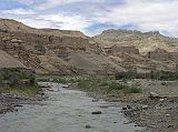 Tibet Guge 01 To 19 Sutlej Canyon Exit We enter narrow deep gullies; corridors in fantastic castles; from time to time, wide spaces on which stand vertically towers and peaks  contorted, ponderous  or there rise solitary monolithic columns with enormous capitals. - Giuseppi Tucci: Secrets of Tibet (September 18, 1933)